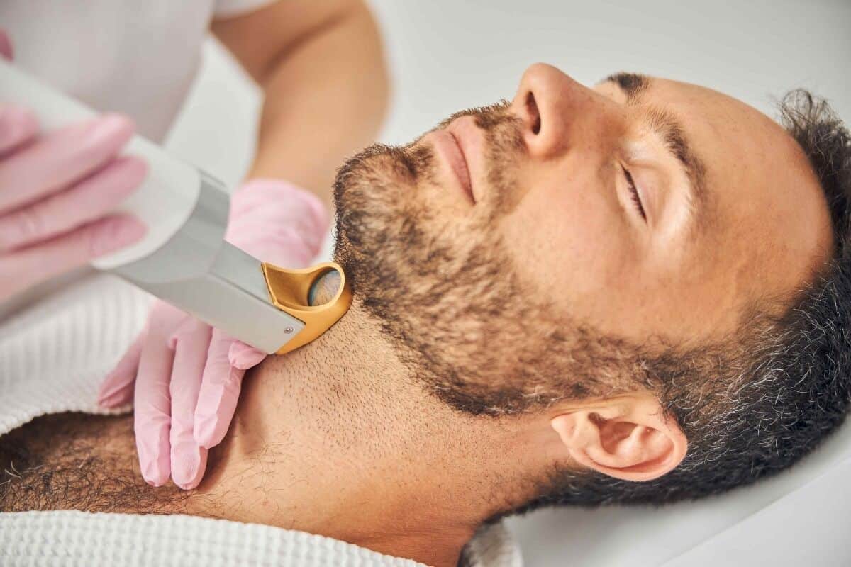 laser hair removal service applied to a man's neck